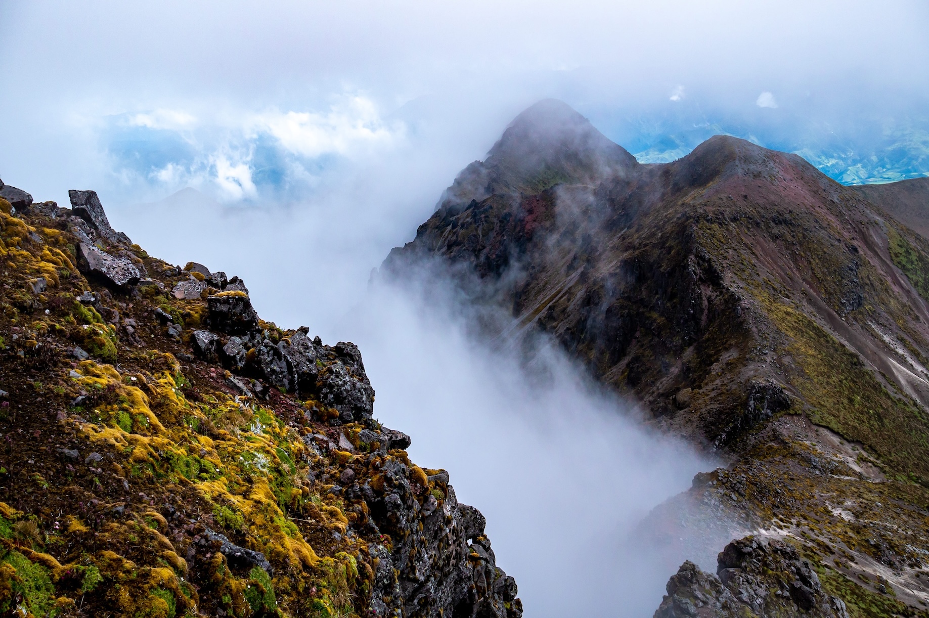 Misty Andes mountains peak with cloud forest in Ecuador